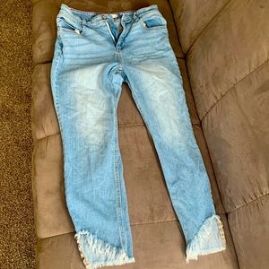 Blue jean pants with distress on the legs